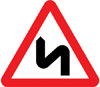 Double bend or series of bends ahead, first to the left