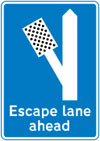 Escape lane to left for vehicles unable to stop on a steep hill
